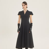 Dress with pleat at the front