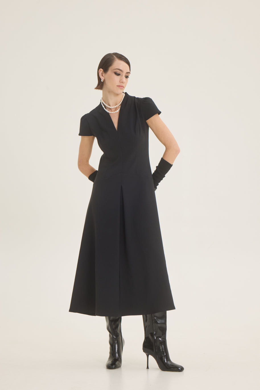 Dress with pleat at the front