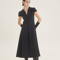 Dress with pleat at the front