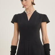 Dress with pleat at the front