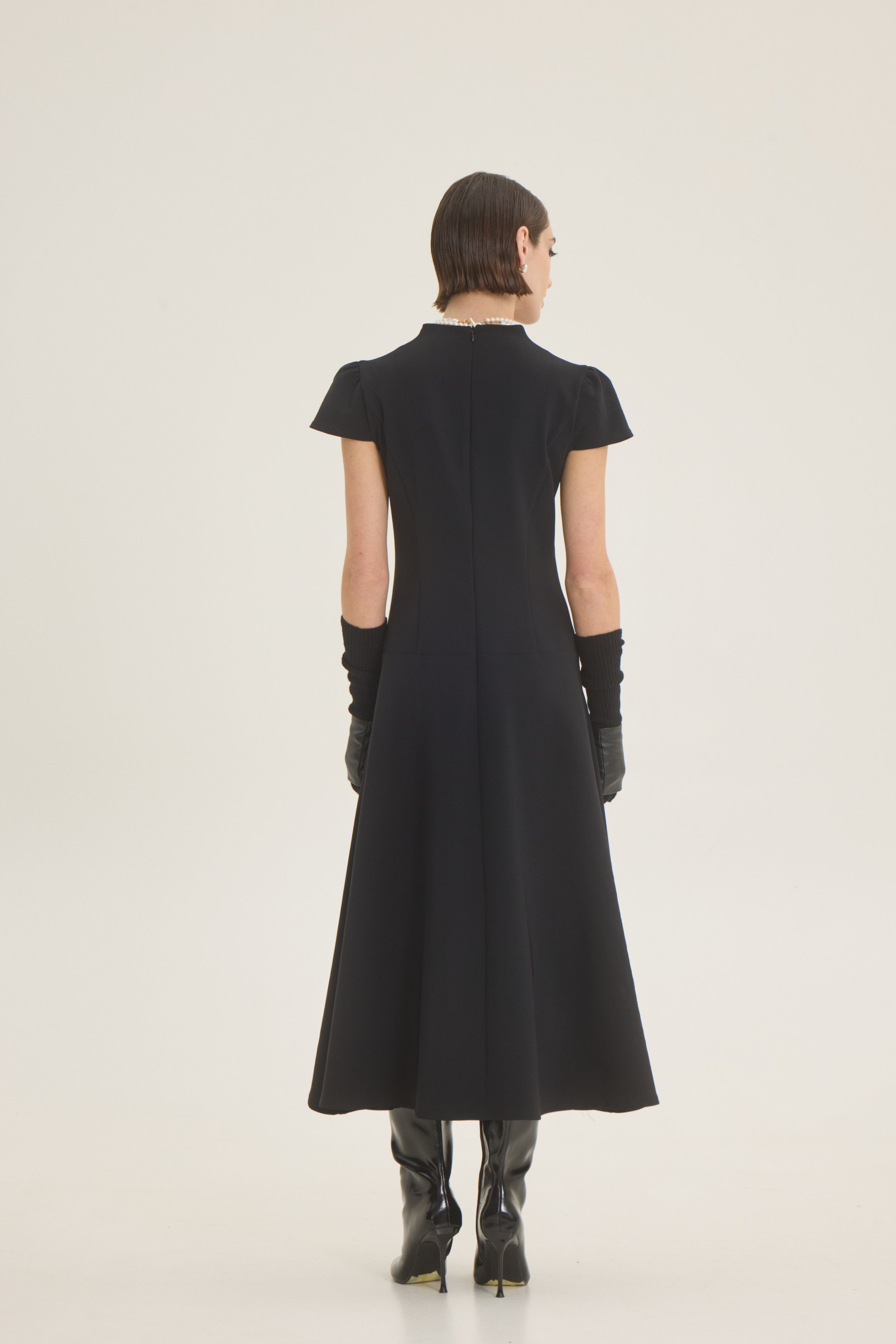 Dress with pleat at the front