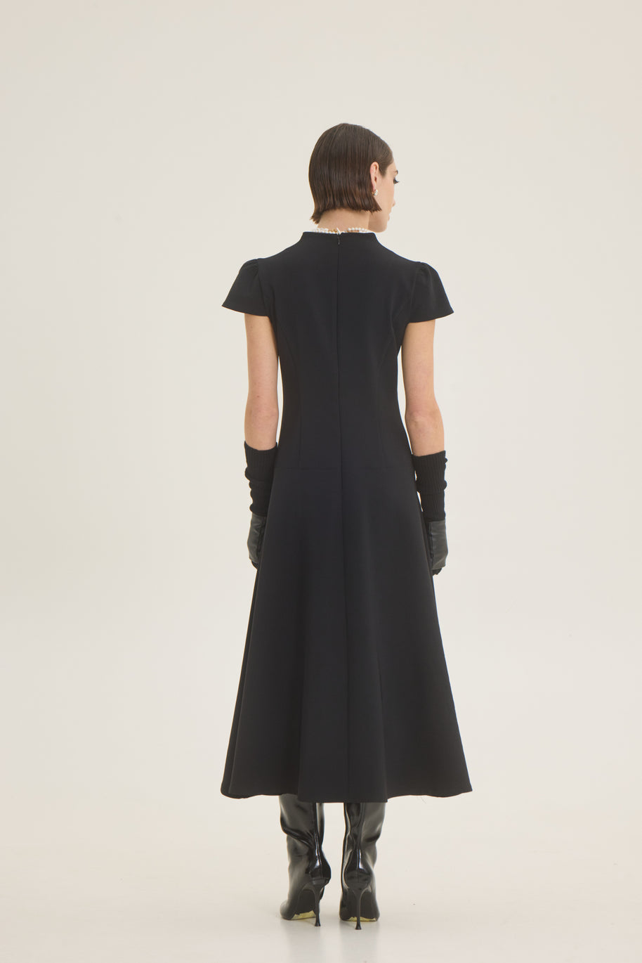 Dress with pleat at the front