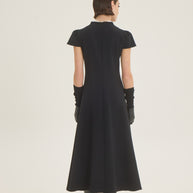 Dress with pleat at the front