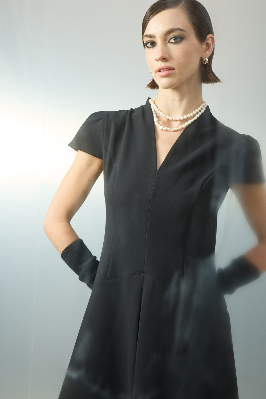 Dress with pleat at the front