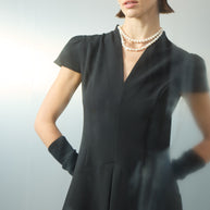 Dress with pleat at the front